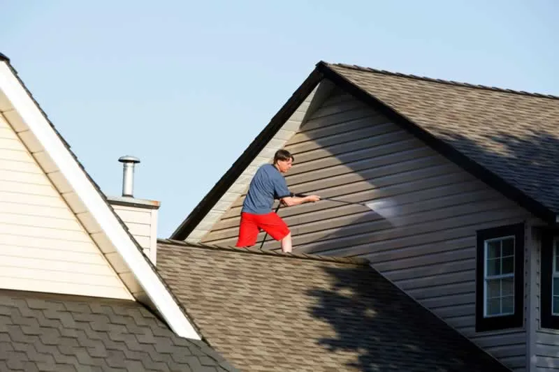 pressure washing a house