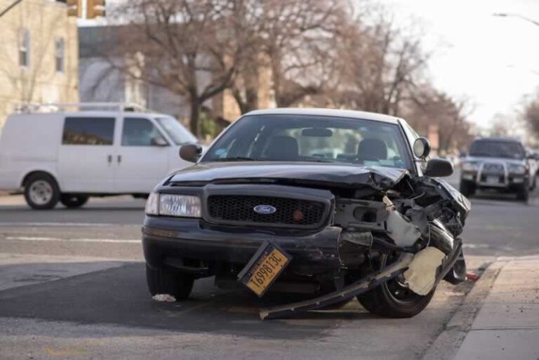 car with destroyed front end after accident