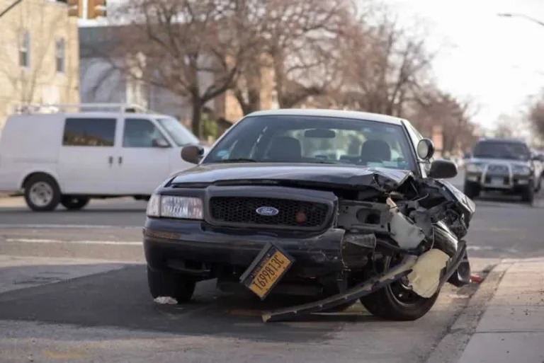 car with destroyed front end after accident