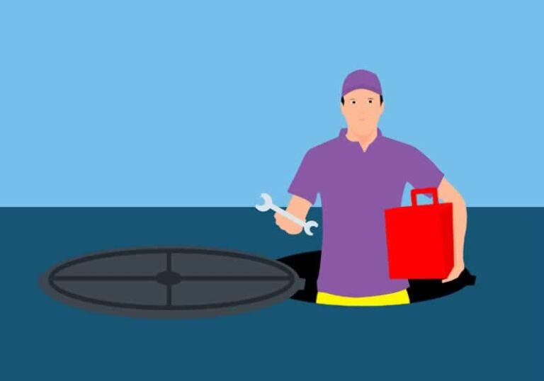 man going into septic tank