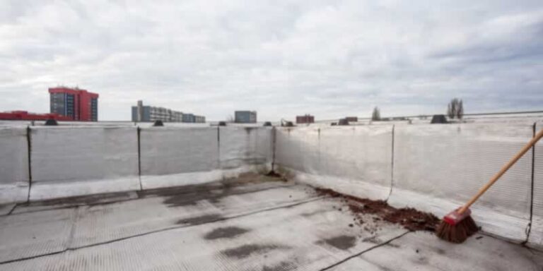 cleaning roof before flat roof replacement