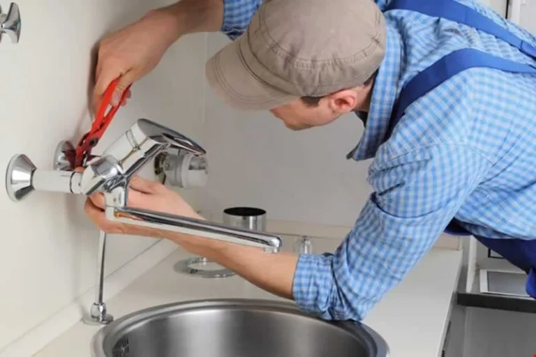 plumber fixing pipe