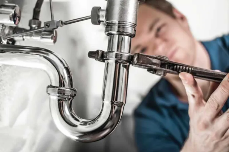 plumber fixing the drain