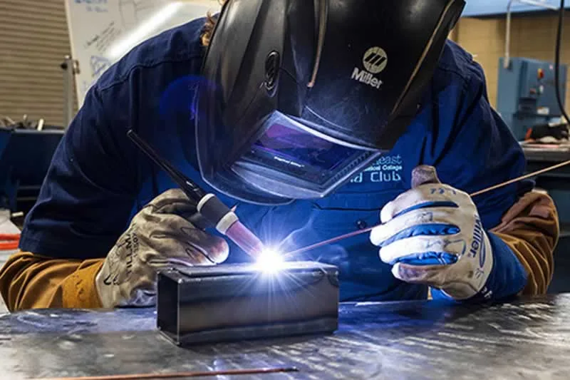 man welding