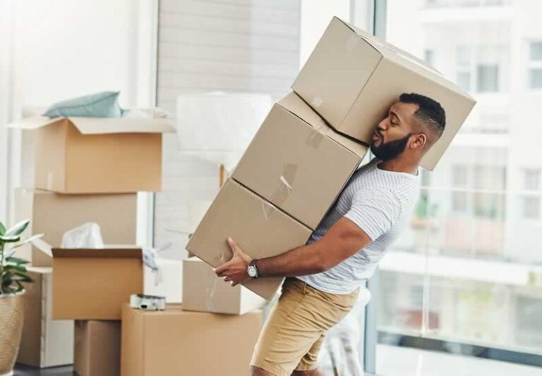 man carrying boxes