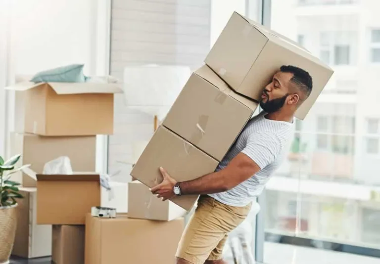man carrying boxes