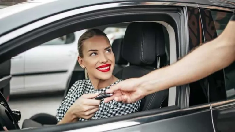 woman receiving car keys