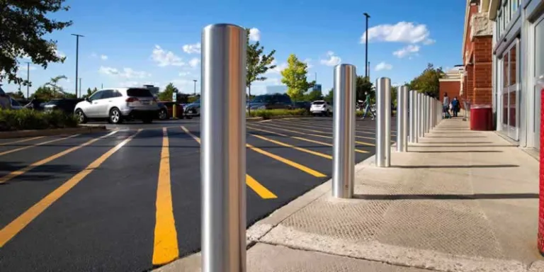 steel bollards separating sidewalk and road
