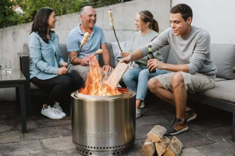 people around smokeless fire pit baking marshmallows