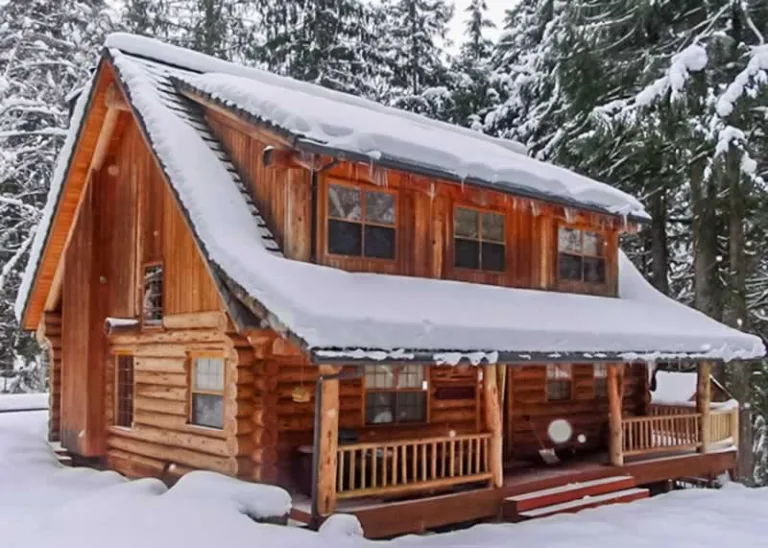 log cabin under snow