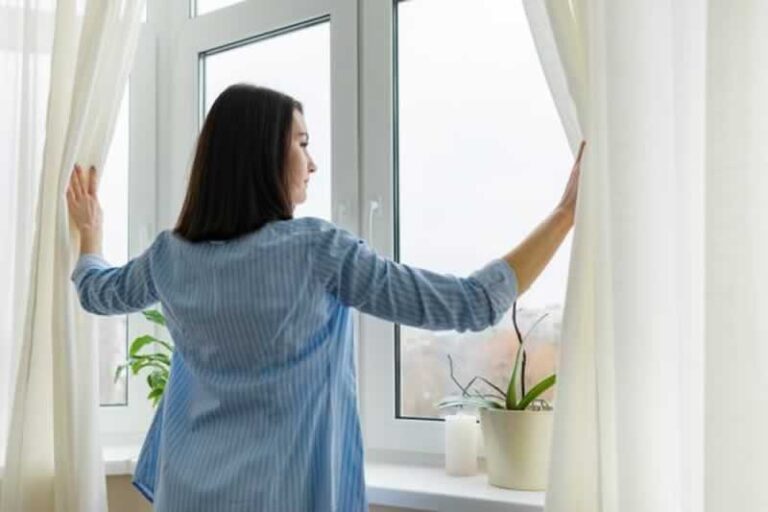 woman looking at the window