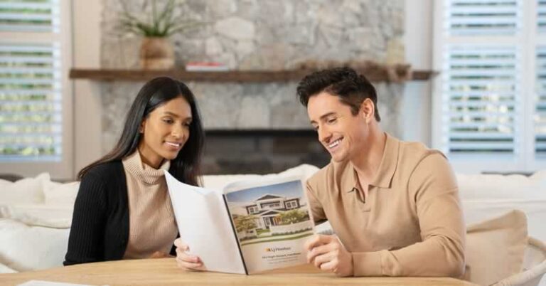 couple reading real estate magazine