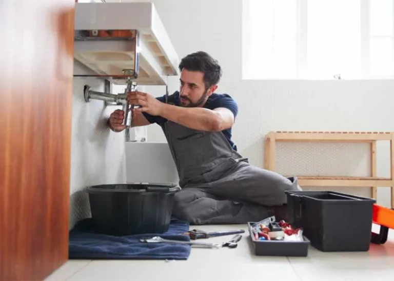 plumber fixing the drain