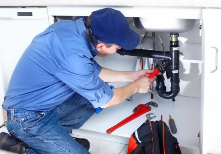 plumber fixing drain