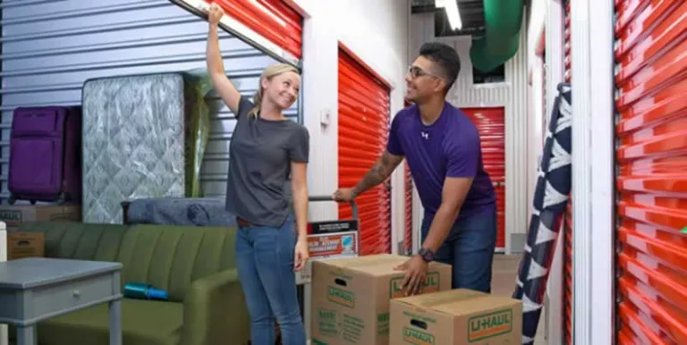 couple loading boxes in storage unit