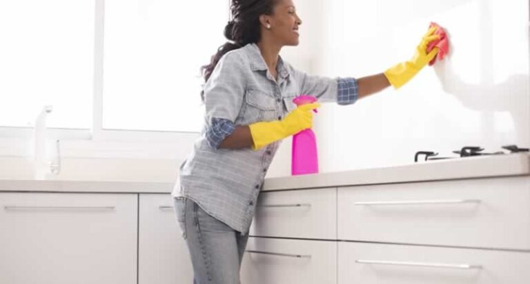 woman cleaning kitchen