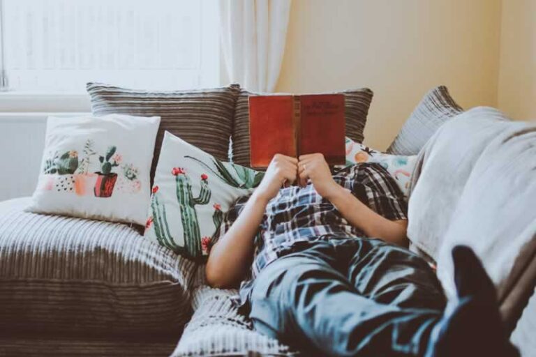 man reading on the bed