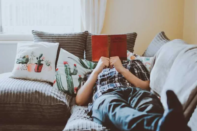 man reading on the bed