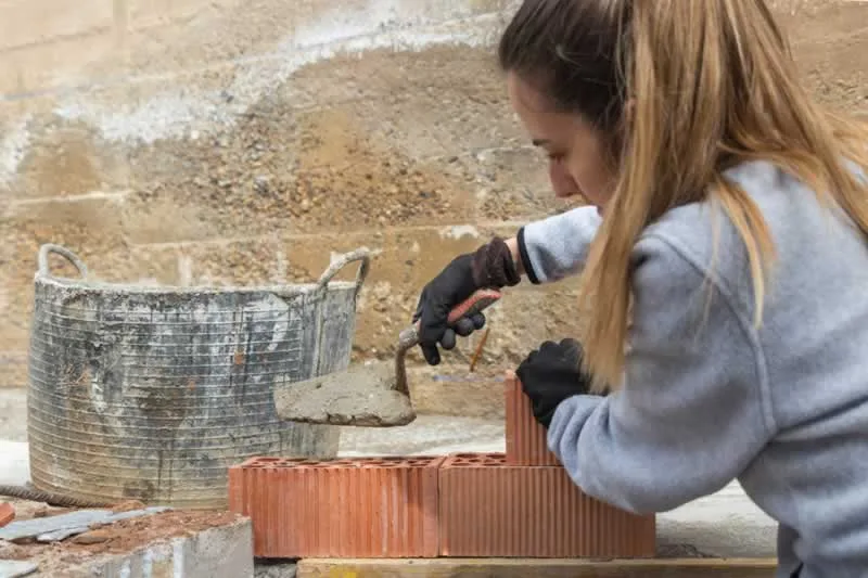 woman building wall