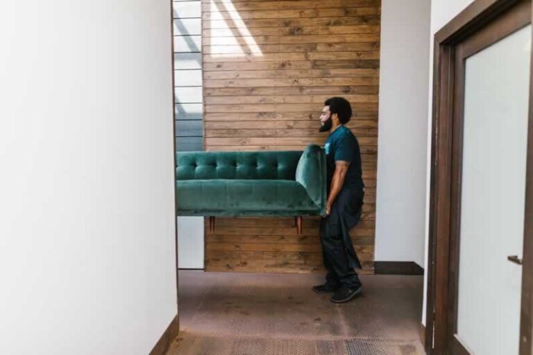 man carrying sofa