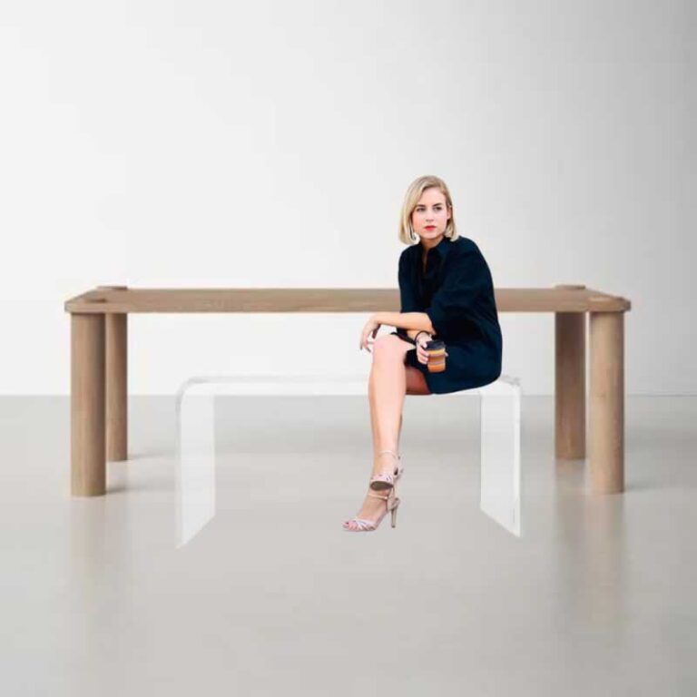 woman sitting on acrylic bench
