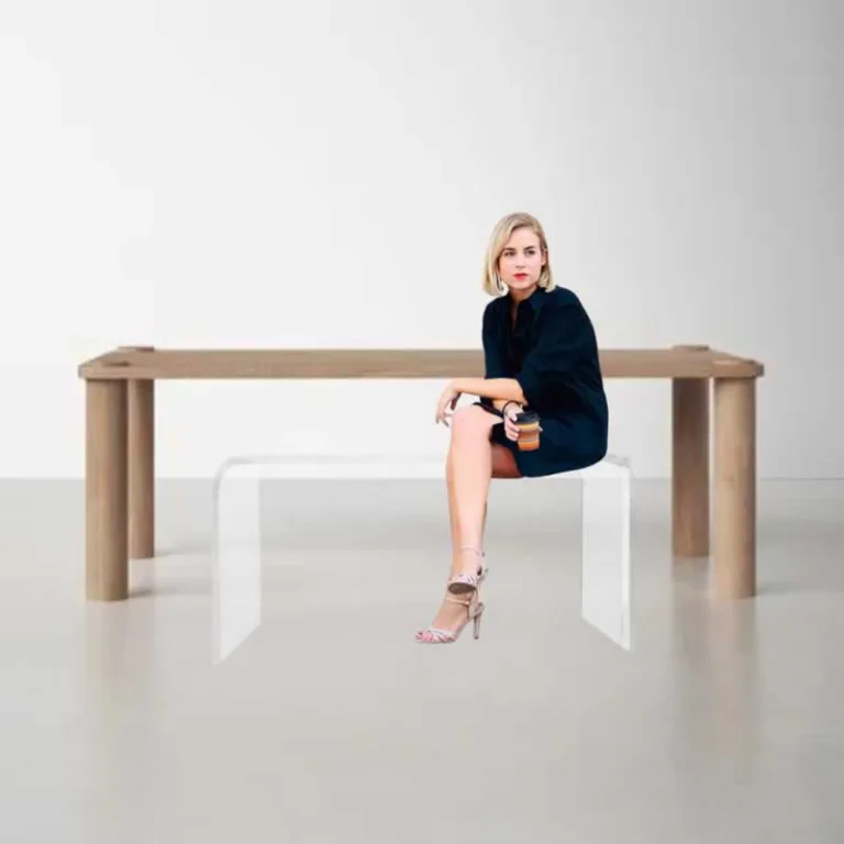 woman sitting on acrylic bench