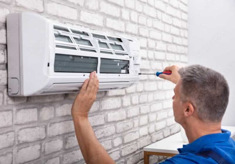 Ac technician fixing indoor unit