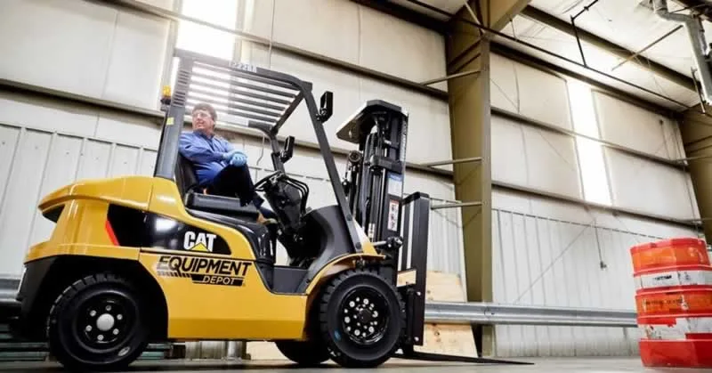 men operating a forklift