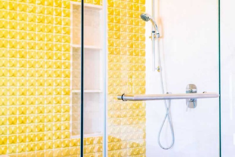 shower cabin with yellow tiles