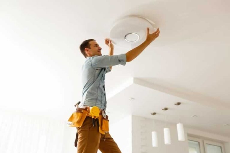 repairmen changing light