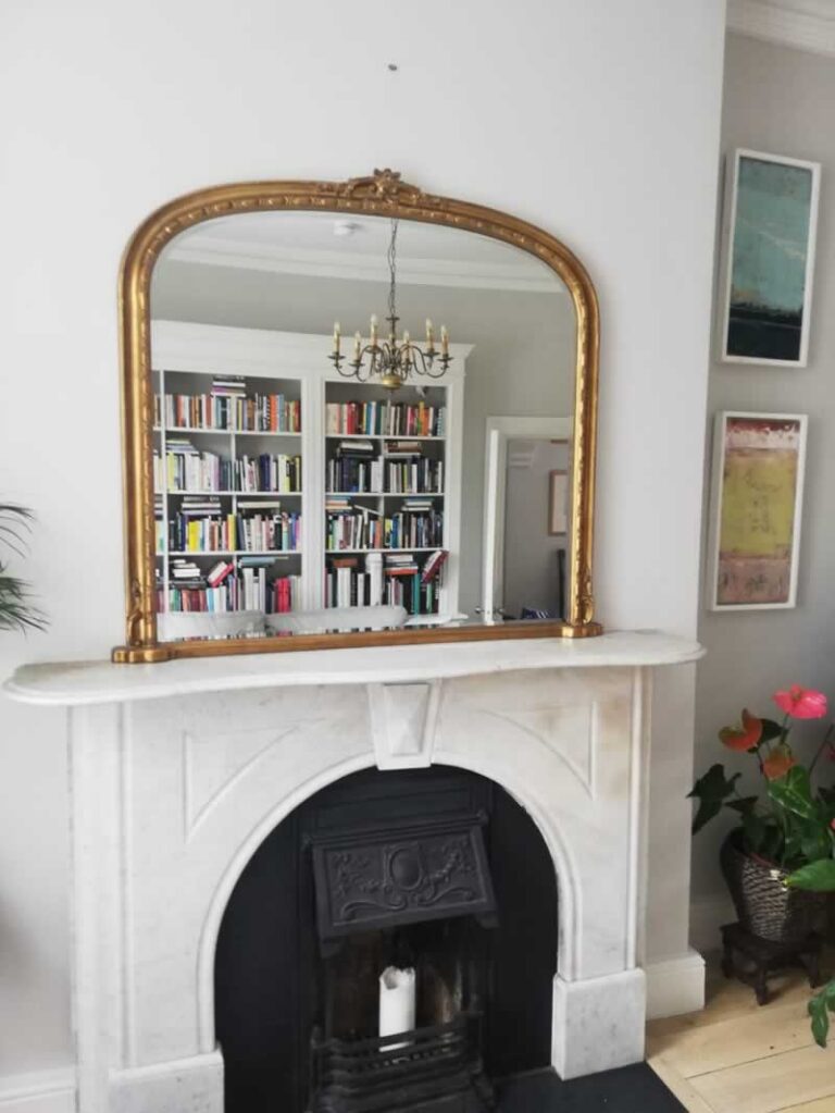 mirror above fireplace