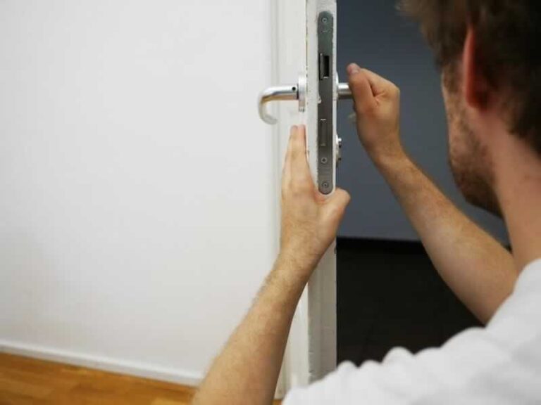 man fixing lock