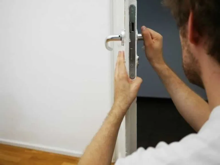 man fixing lock