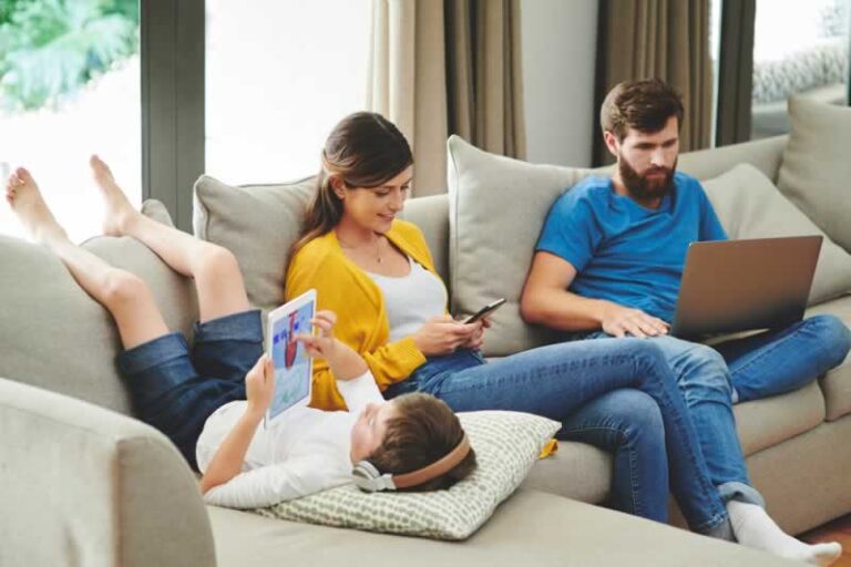 family using gadgets online