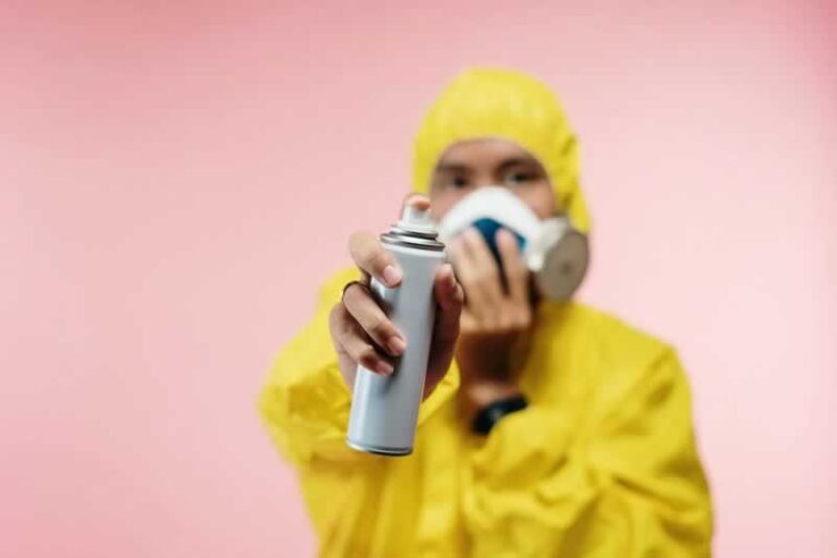 man spraying pests