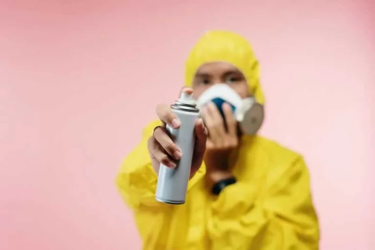 man spraying pests