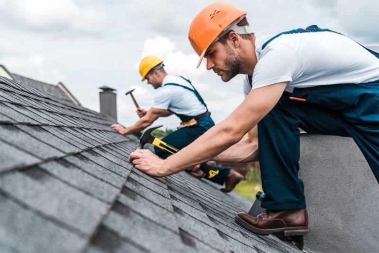 roofers fixing the roof