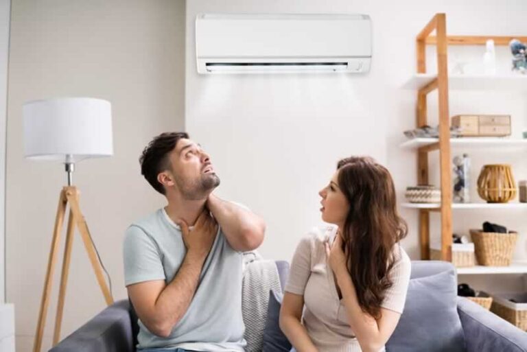 couple under broken AC