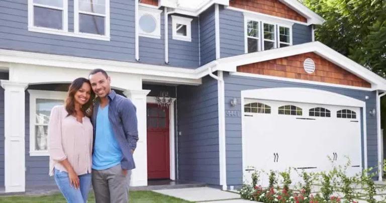 couple in front of their house