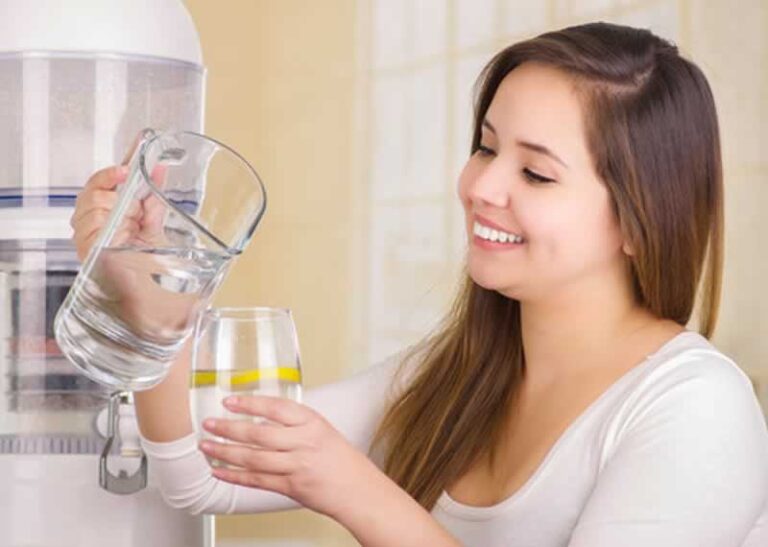 woman pouring filtered water