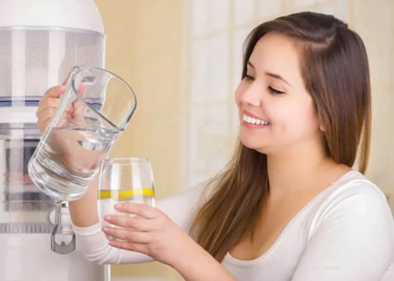 woman pouring filtered water