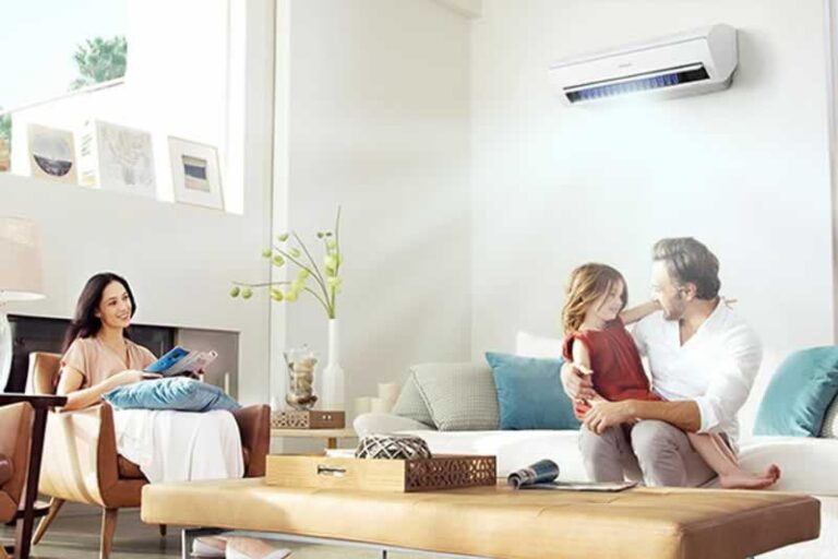 family under air conditioner
