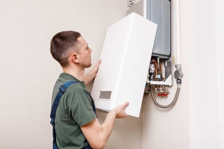 man installing boiler