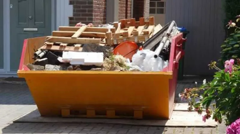 dumpster in front of the house