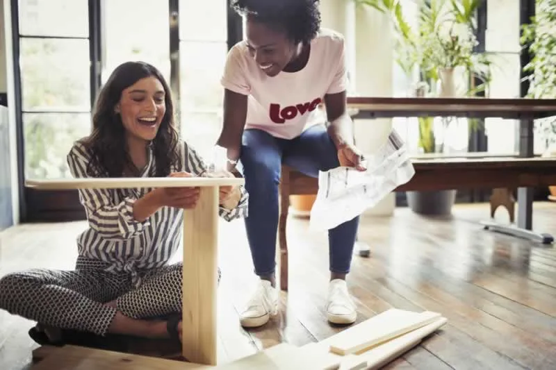 girlfriends assembling IKEA flat pack furniture