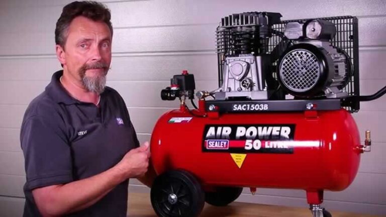 man servicing air compressor