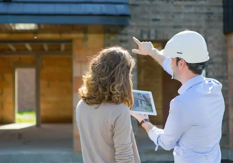 home inspector showing problems to the homeowner