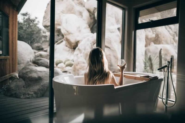 woman in bathroom with biophilic design