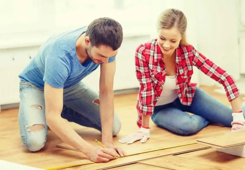 couple during DIY flooring project