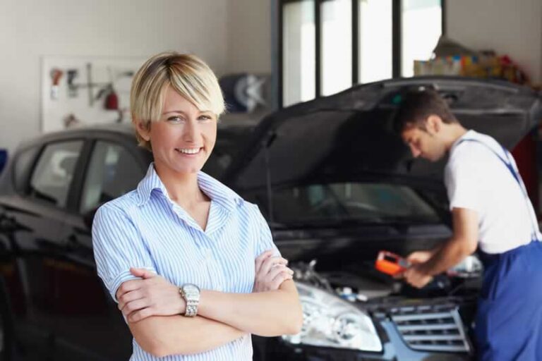 woman servicing car